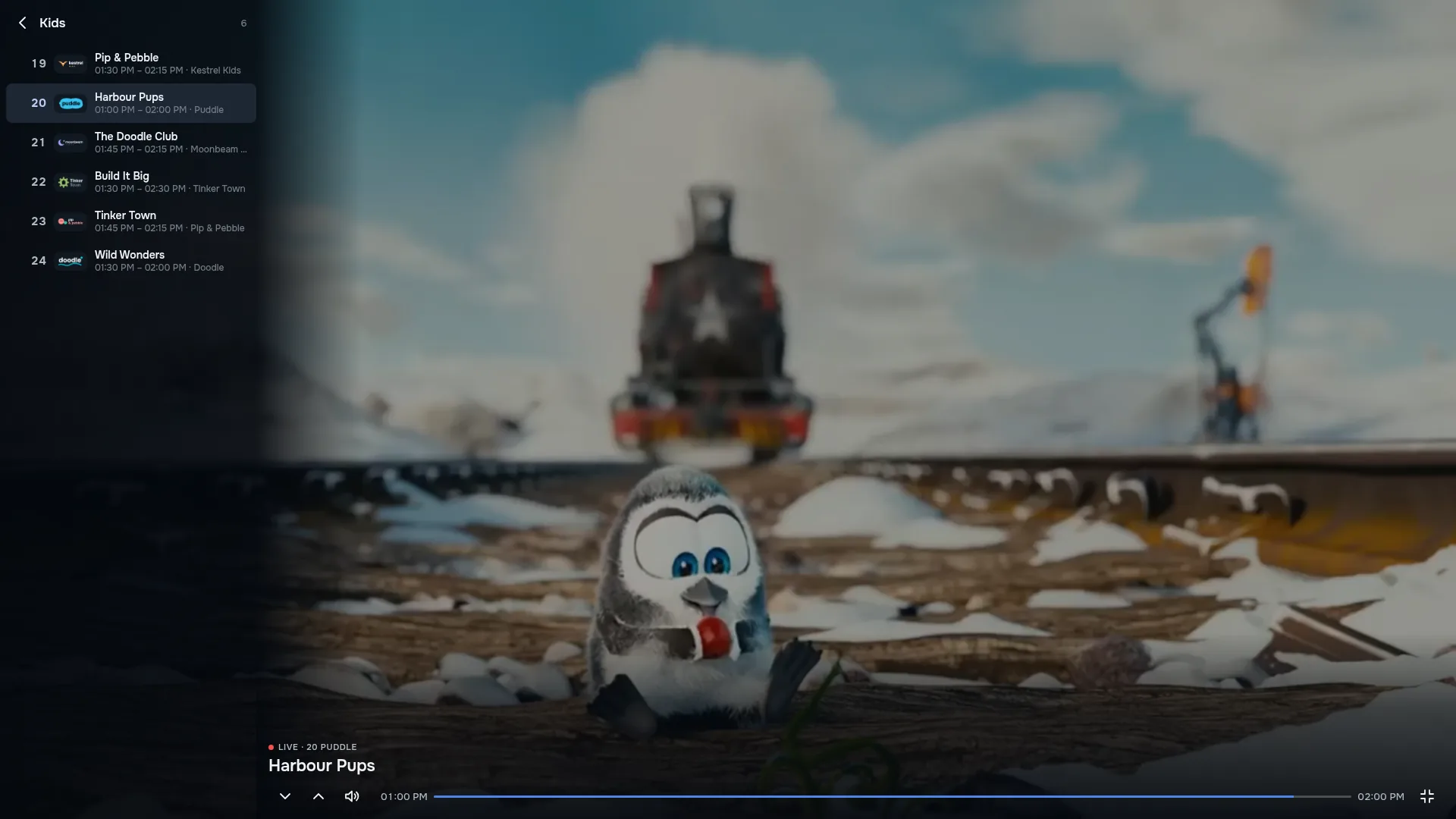 ZiroTV’s full-screen player on a computer: the Kids channel Puddle showing a small penguin on snowy railway tracks with a steam train behind it, the channel list on the left, the programme Harbour Pups marked live, and its timeline from 01:00 PM to 02:00 PM with the player controls.